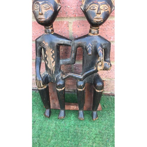 45 - Tribal carved family