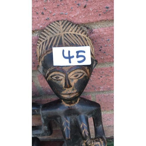 45 - Tribal carved family