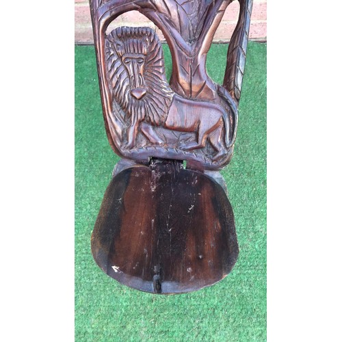 69 - Carved two piece African chair