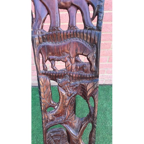 69 - Carved two piece African chair