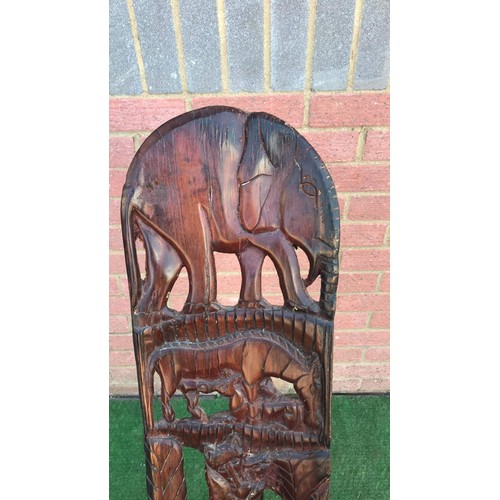 69 - Carved two piece African chair