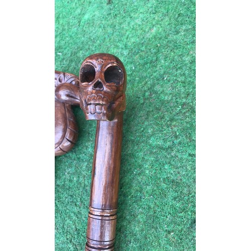 68 - 2 wooden carved walking sticks (see condition report)