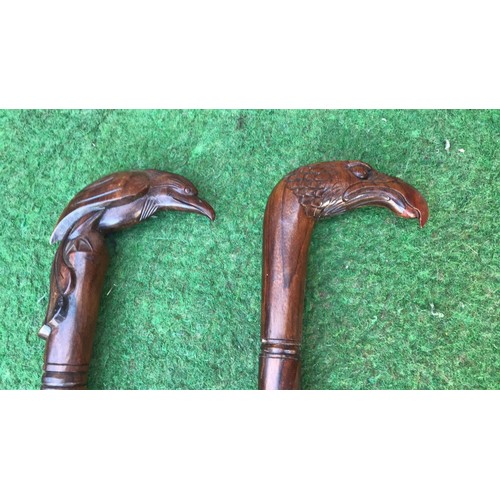 66 - 2 wooden carved walking sticks