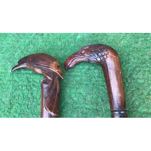 66 - 2 wooden carved walking sticks