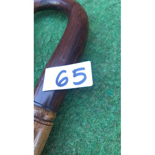 65 - 2 wooden carved walking sticks ( see condition report )