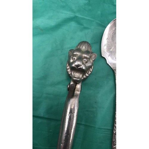 241 - Collection of flatware to include lion head nutcrackers