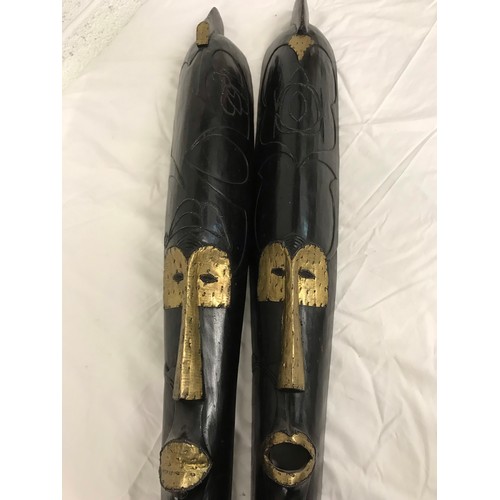 246 - Pair of long carved wooden face masksWith gold coloured detailheight- 44 incwidth-6 inc... 