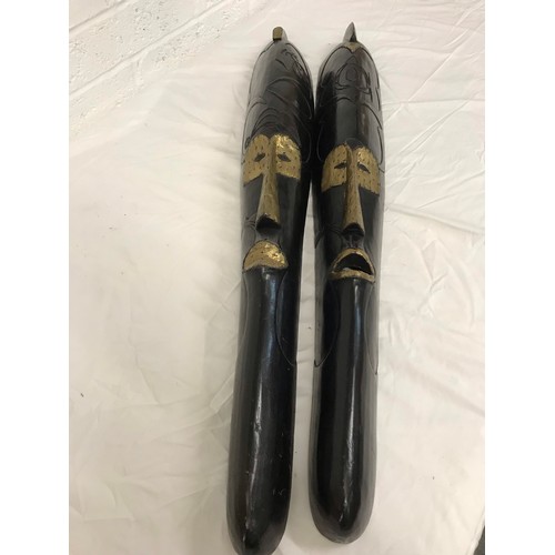 246 - Pair of long carved wooden face masksWith gold coloured detailheight- 44 incwidth-6 inc... 