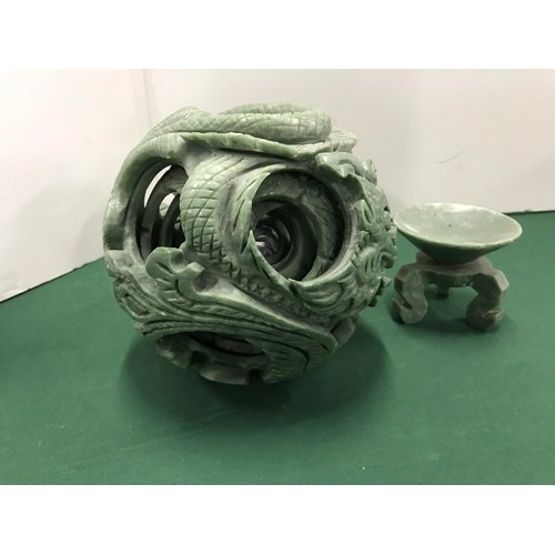 257 - Green soap stone One piece Puzzle ball with Dragon Motive on standsee pictures