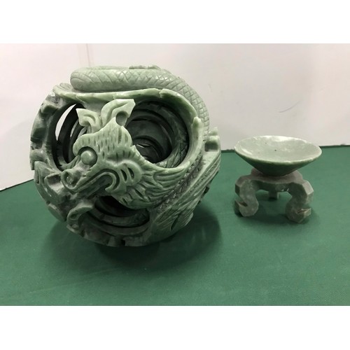 257 - Green soap stone One piece Puzzle ball with Dragon Motive on standsee pictures