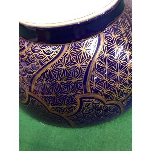 272 - Round oriental bowel with white inside floral detail and sale detail to outer side in purple