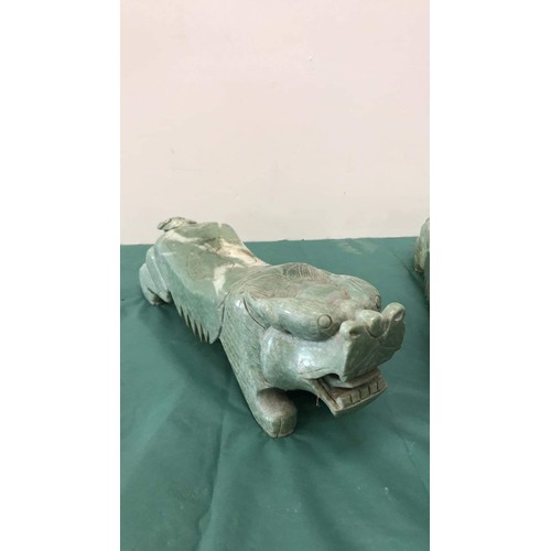 332 - Two large soapstone dogs