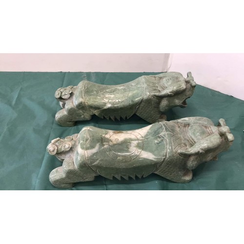 332 - Two large soapstone dogs