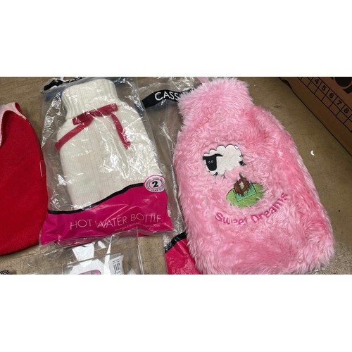 673 - 5 hot water bottles & covers