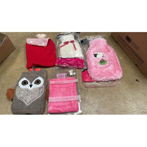 673 - 5 hot water bottles & covers