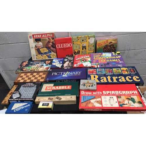 28 - large assortment of board games to include rat race scrabble and more