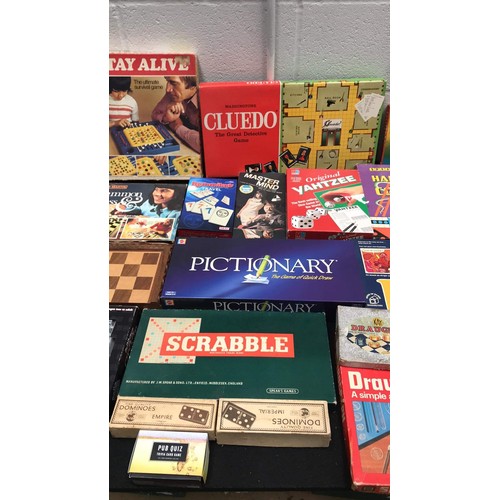 28 - large assortment of board games to include rat race scrabble and more