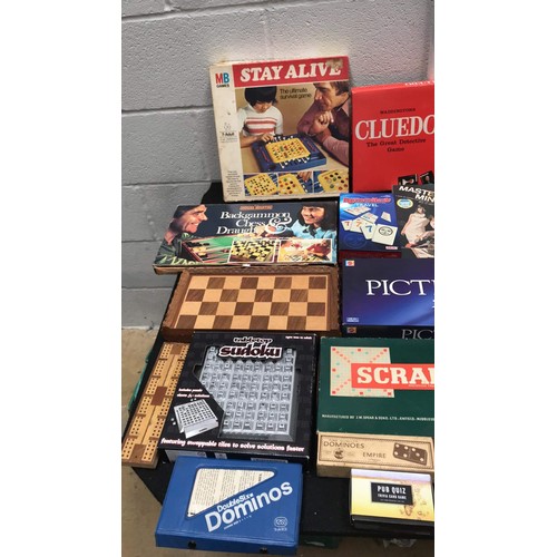 28 - large assortment of board games to include rat race scrabble and more