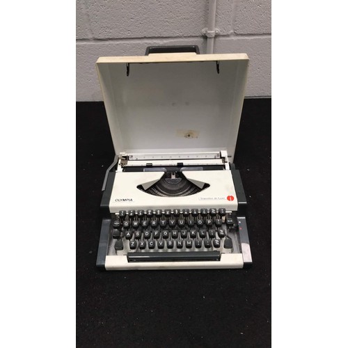 48 - small portable typewriter