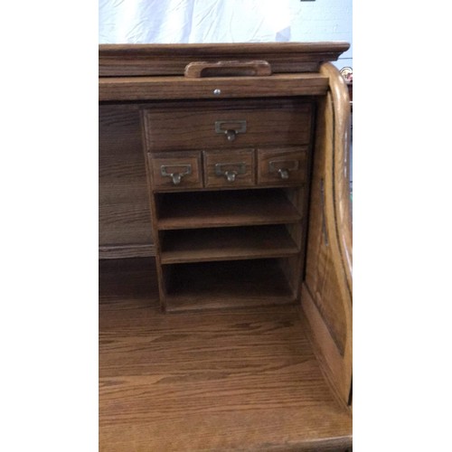 99 - Oak rolled top desk with modern computer layout