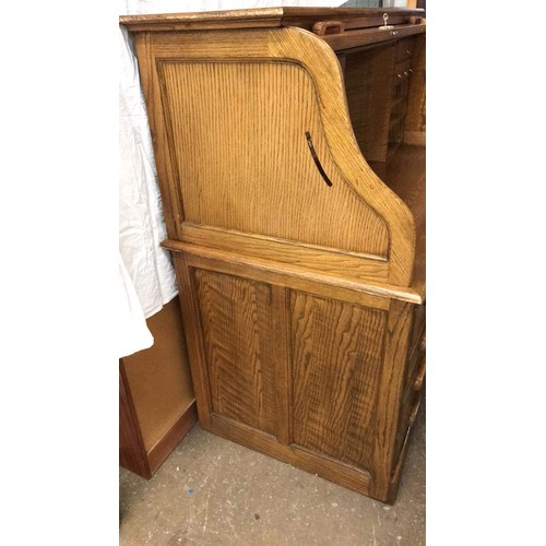 99 - Oak rolled top desk with modern computer layout