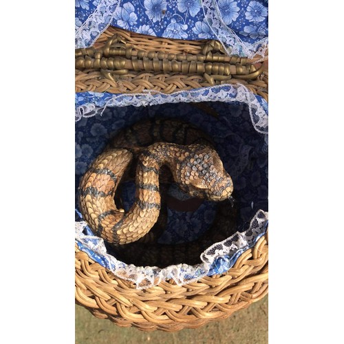 435 - bamboo stand with whicker basket  containing snake