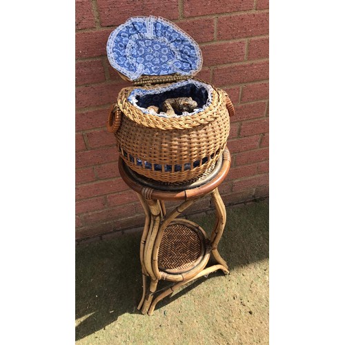 435 - bamboo stand with whicker basket  containing snake