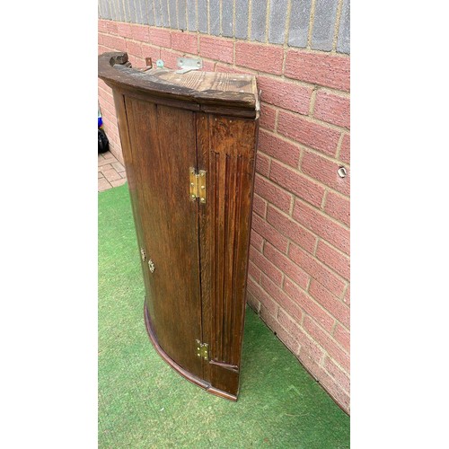 137 - GEORGIAN OAK BOW FRONTED WALL HANGING CORNER CUPBOARD