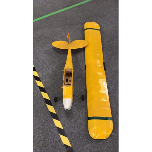 417 - PART OF A MODEL AEROPLANE IN YELLOW