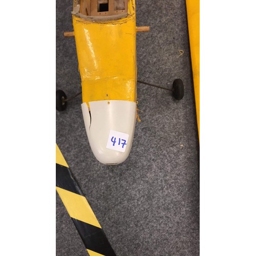 417 - PART OF A MODEL AEROPLANE IN YELLOW