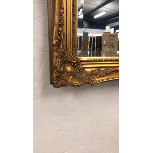 438 - LARGE ORNATE FRAMED MIRROR