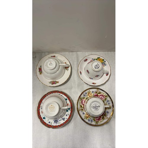 90 - Four decorative teacups and saucers