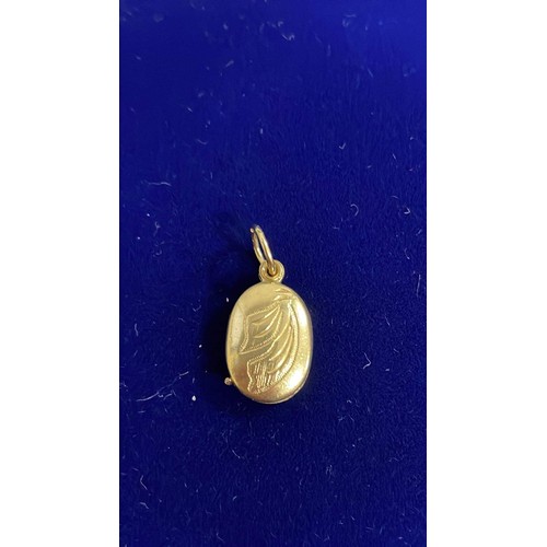 218 - 14ct gold locket pendant - weight 2.15g