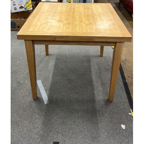 145 - SQUARE OAK DINNING TABLE WITH PULL OUT LEAVES DOES HAVE A CHIP TO TOP SEE PICTURE