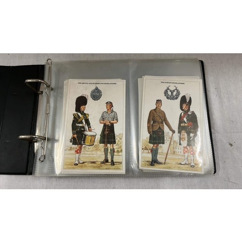 235 - BROWN FOLDER OF OVER 40 MILITARY UNIFORM POST CARDS