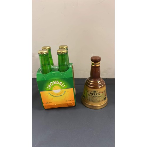 140 - BELLS WADE DECANTER WITH CONTENTS OF WHISKY AND FOUR BOTTLES OF SNOWBALL SNOWBALL IS FOR DISPLAY ONL... 