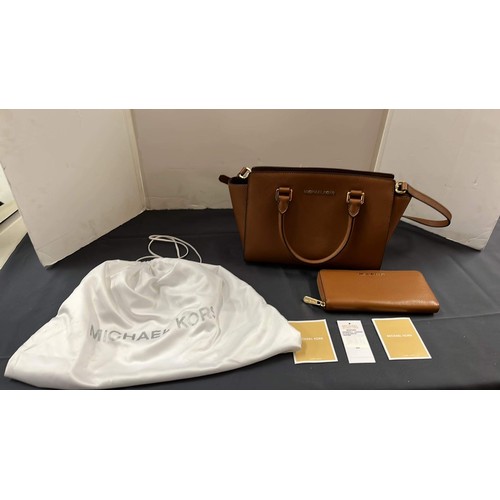 27 - MICHAEL KORS BROWN HAND BAG AND PURSE