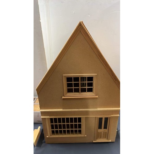 89 - UNUSED DOLLS HOUSE AND BOXED FURNITURE