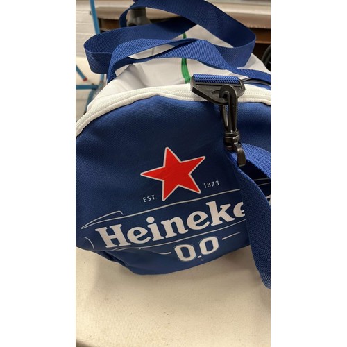 87 - HEINEKEN BAG , BASEBALL CAP