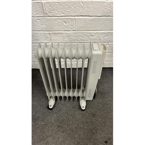 62 - SMALL PORTABLE OIL HEATER