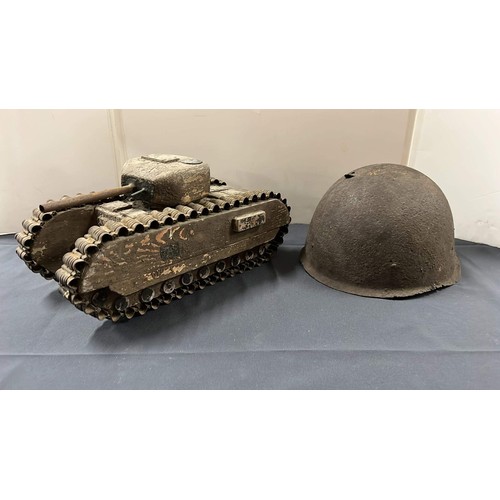 30 - WOODEN TANK AND METAL HELMET