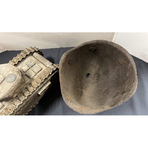 30 - WOODEN TANK AND METAL HELMET