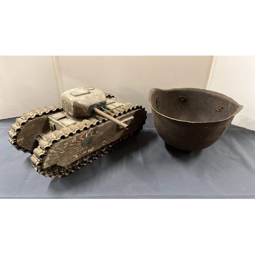 30 - WOODEN TANK AND METAL HELMET