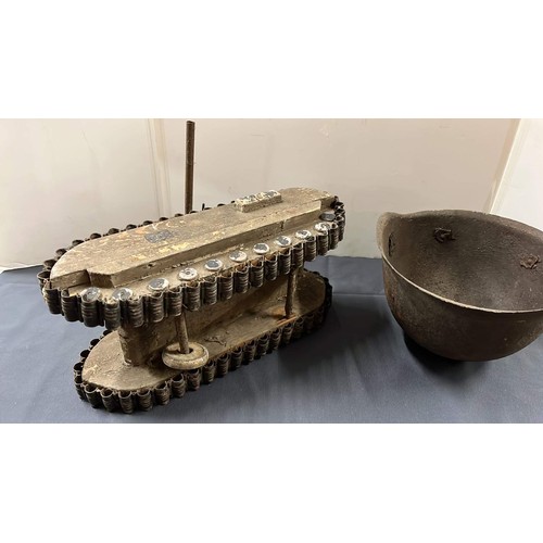 30 - WOODEN TANK AND METAL HELMET