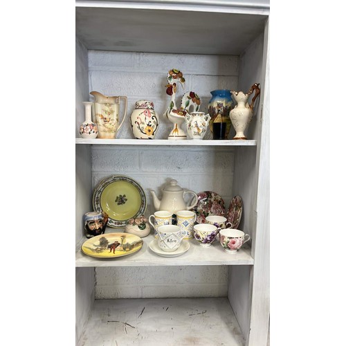 172 - Two shelves of decorative items