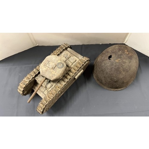 30 - WOODEN TANK AND METAL HELMET