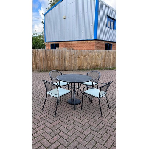 440 - Garden table & 4 chairs with cushions and parasol base