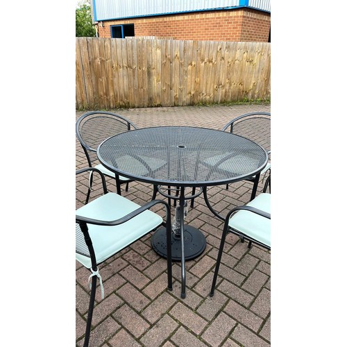 440 - Garden table & 4 chairs with cushions and parasol base