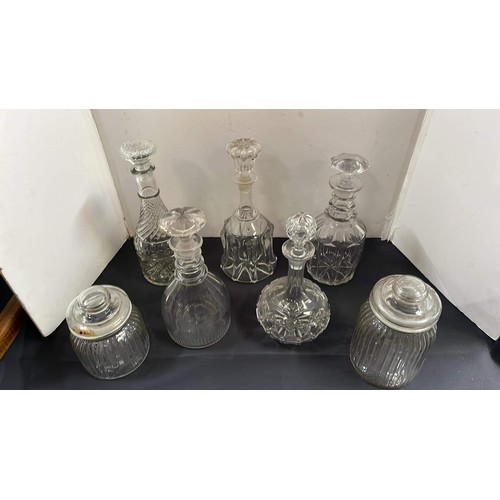 150 - GLASS DECANTERS AND STORAGE JARS