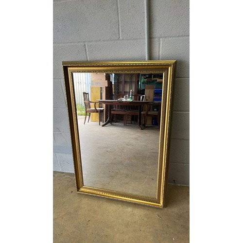 668 - GOLD COLOURED FRAMED MIRROR